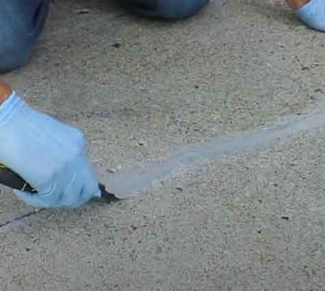 A high grade concrete sealant is used to repair a concrete crack
