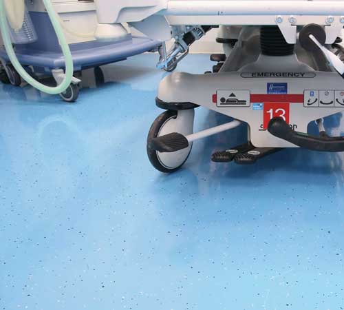 Health care facility with blue polyaspartic metallic flake finish