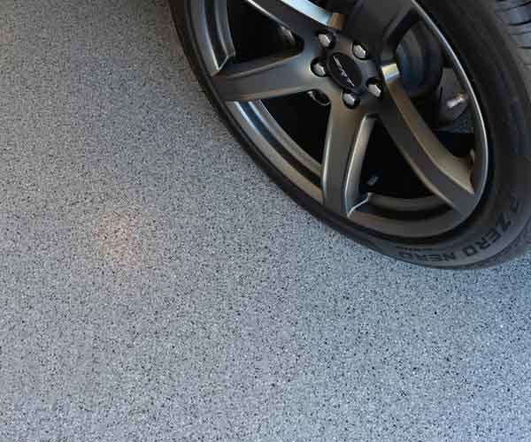 Blue flake epoxy garage floor with polyaspartic top coat